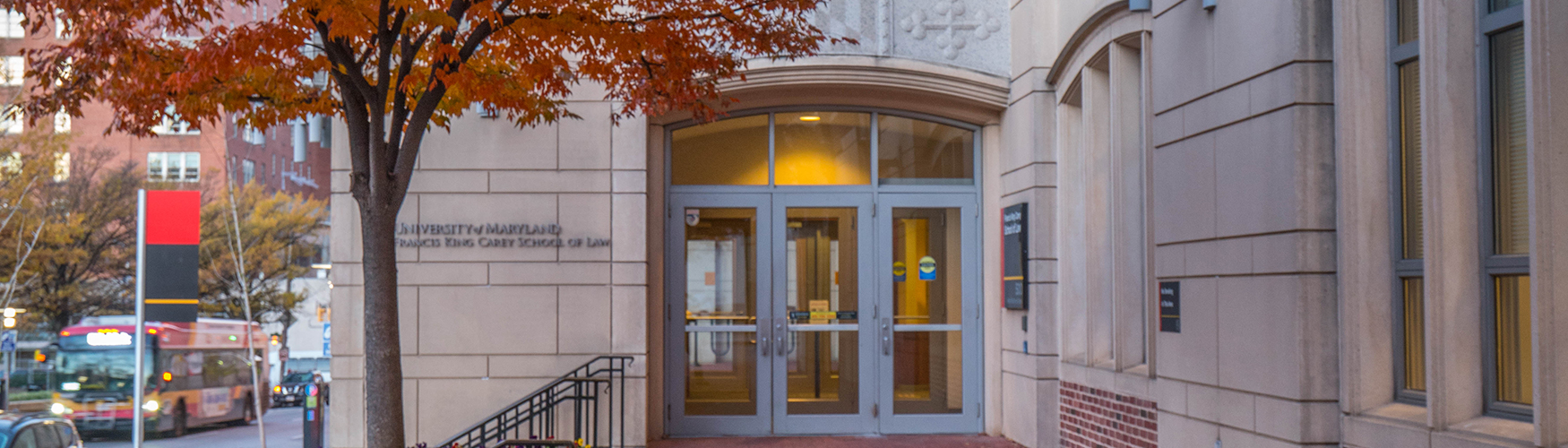 Picture of fall leaves at the entrance of Maryland Carey Law building