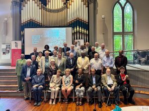 Attendees pose for a group shot in Westminster Hall.