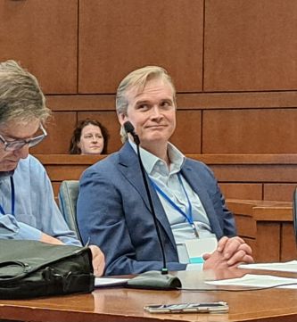 Person sitting on a panel in the Ceremonial Courtroom